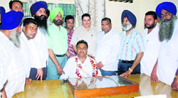 SAD and BJP leaders, along with councillors, flank president Vijay Jain at Raikot