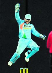 Mahendra Singh Dhoni celebrates as India defeat Sri Lanka