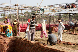 Stage being erected for the rally to be held for marking the commencement of construction work for the 1980 megawatt super critical thermal power plant at village Banawali, near Talwandi Sabo.