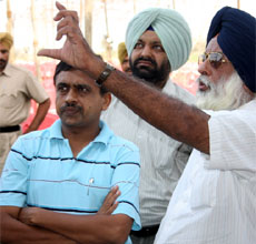 DIG Faridkot range Jitendera Jain looks at the arrangements as J.S. Brar, member generation, PSEB, explains.