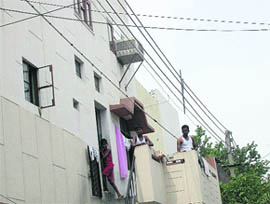 High-tension wires pass dangerously close to flats in Chandigarhs Bapu Dham colony, posing a threat to the residents.