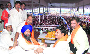 (From left) BSP leaders Mann Singh Manhera, Zakir Hussein and former cricketer Chetan Sharma at a rally held in Sohna on Wednesday.