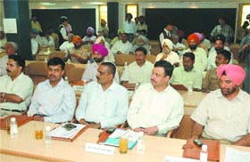 Senior bureaucrats and police officials attend a seminar in Jalandhar