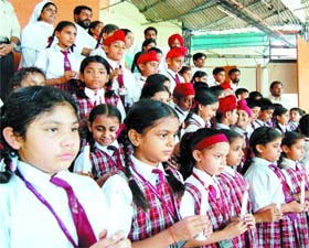 Students of St Francis School pay tributes to the persons killed in violence in J&K and Orissa