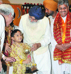 Agam Shingari being honoured by Punjab Chief Minister Parkash Singh Badal during a function at DAV Public School in Amritsar. 