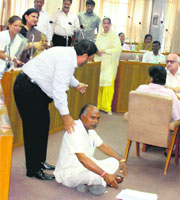 Nominated councillor M P S Chawla tries to pacify BJP councillor Ram Lal, who staged a dharna in the House on Monday.