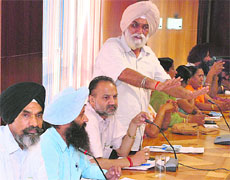 Municipal councillors during a press conference at MC Bhawan in Mohali on Friday.