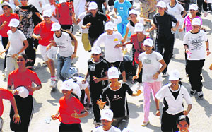 Students of GCG, Sector-42, Chandigarh, take part in Run for Fun organised on the occasion of National Sports Day on Friday.