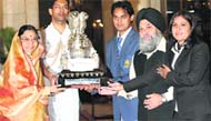 Dr Yashpal Singh, vice-chancellor, Punjabi University, Patiala, receives the Maulana Abul Kalam Azad Trophy from President Pratibha Patil. 