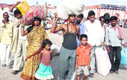 A flood-affected family from Madhepura in Bihar arrives at Ludhiana railway station