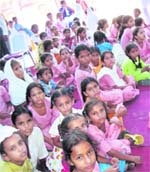 Children of Bir Raoke village in Moga district attend a function at the village school