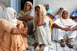 Shocked family members of the deceased mourning the incident at their house in village Chak Fateh Singh Wala on Sunday.