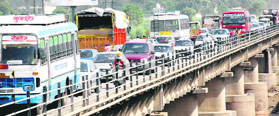 Vehicles caught in a traffic jam on the Ghaggar bridge near Dera Bassi on Sunday.