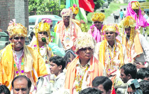 Bridegrooms arrive for a mass wedding ceremony organised by the City Club in which 11 couples belonging to poor families got married in Karnal on Sunday.
