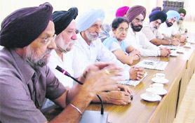 Academicians gather to oppose the state governments move of giving central status to Panjab University at GGN Khalsa College in Ludhiana on Sunday.