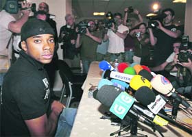 Real Madrid's Brazilian player Robinho takes his seat at a news conference as he made a desperate late bid to persuade Real Madrid to allow him to move to Chelsea