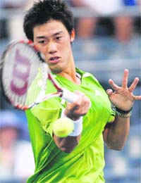 Kei Nishikori of Japan returns a shot to David Ferrer of Spain during their match at the U.S. Open tennis tournament at Flushing Meadows in New York