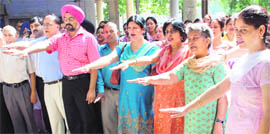 Employees of Life Insurance Corporation take a pledge to mark the 52nd anniversary in Chandigarh on Monday.