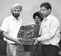 New Patiala deputy commissioner Vikas Garg takes charge from the outgoing DC, D.S. Grewal, during a farewell party in Patiala on Monday.