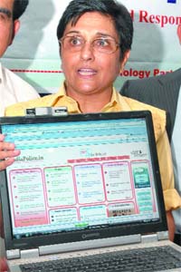 Former Delhi police officer and chairperson of India Vision Foundation and Navjyoti, Kiran Bedi, launches a website www.Indiapolice.in, for police personnel during a press conference in New Delhi