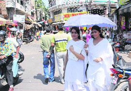 Students on their way to schools and colleges in Jammu which reopened after over two months on Monday