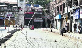 CRPF personnel patrol near the Watch Tower at the Lal Chowk in Srinagar on Monday. 