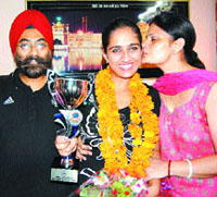 Muneet Chhatwal, who has won an international debate contest held at Istanbul, being congratulated by her family in Amritsar.