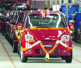 The Spark, one of General Motors passenger vehicles, prepares to roll out from company's new plant in Talegaon, 160 km northeast of Mumbai, on Tuesday. General Motors Corp's most important priority is to turn around its North American business and it will continue investments in emerging markets, its chief operating officer said on Tuesday.