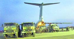 Troops and relief material are loaded on to an IAF aircraft at Chandigarh