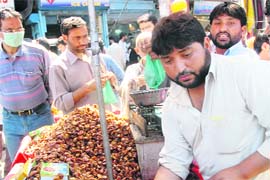 Muslims buy dates on the first day of the holy fasting month of Ramadan in Srinagar