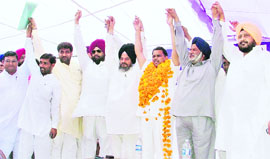 Senior BSP leaders raise hands to express solidarity at the rally in Ludhiana on Tuesday.