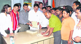 Congress workers fill in forms at the launch of a membership drive at Congress Bhawan in Ludhiana on Tuesday. 
