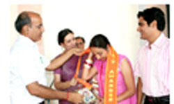 Chief guest B.B. Sharma and principal Venita Singh honouring the PUs B.Ed exam topper Shreshtha Kumari in Abohar