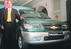 President and COO of General Motors Frederick A.Henderson poses with Chevrolet Tavera Neo-2, which was launched in New Delhi on Wednesday. It is priced at Rs 9.54 lakh (ex-showroom Delhi). 