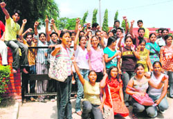 Students of Government College of Commerce and Business Administration, Sector 42, protest outside their college in Chandigarh 