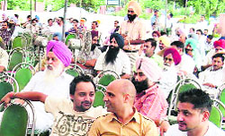 Participants at the auction held by GMADA in Mohali on Wednesday.