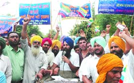 Activists of the Lok Bhalai Party protest the hike in fee by private educational institutes in Jalandhar on Wednesday