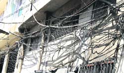 Jumbled bunches of the loosely hanging power and cable TV wires is a common sight in Ludhiana