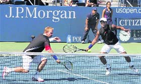 Leander Paes and his Czech partner Lukas Dlouhy (L) during their men's doubles quarterfinal match against Sweden's Robert Lindstedt and Finland's Jarkko Nieminen at the US Open in New York