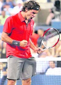 Roger Federer reacts after defeating Russia's Igor Andreev in the fourth round of the US Open
