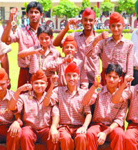 Swimmers of St Soldier Divine Public School, Mithu Basti, Jalandhar, who won medals in the inter-school swimming tourney.