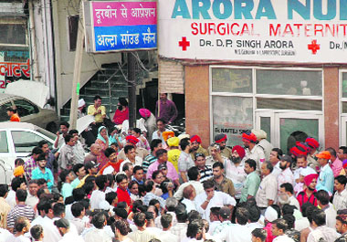 An angry mob demands the closure of Arora Nursing Home.