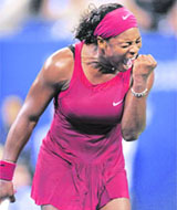Serena Williams of the US reacts during her US Open quarterfinal match against her sister Venus Williams.