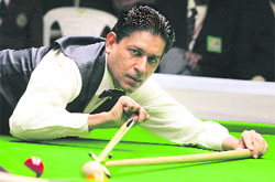 Geet Sethi plays a shot during his semifinal match in the International Billiards and Snooker Federation World Championships in Bangalore on Thursday.