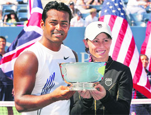 Leander Paes (L) and Cara Black of Zimbabwe pose with the trophy after winning the US Open mixed doubles title against Liezel Huber of the US and Jamie Murray of Great Britain on Thursday.
