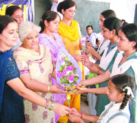 Students present flowers to their gurus on Teachers Day in Amritsar.