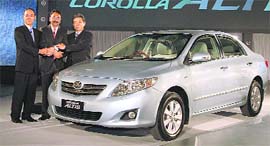 Yasuhiko Yokoi, managing director, Toyota Motors Corporation (L), Vikram Kirloskar, vice-chairman, Toyota Kirloskar Motors (center) with Hiroshi Nakagawa, managing director, Toyota Kirloskar Motors, at the launch of Altis at Greater Noida on Friday