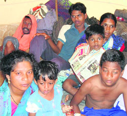 Mamta Pradhan (seated extreme left) with her family at Udaygiri relief camp in Kandhamal.