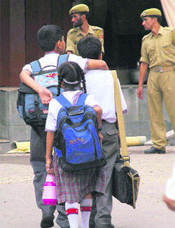Children on their way to school in Jammu which reopened after over two months.