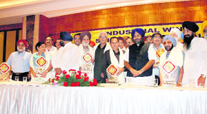 Sukhbir Badal with industrialists in Ludhiana on Thursday. 
